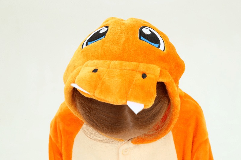 Close-up of Charmander Onesie For Kids hood featuring character face and design elements